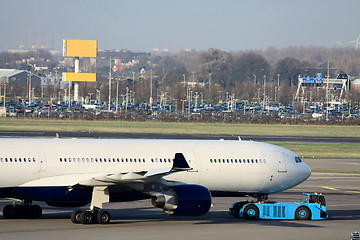 Image showing Airplane pulled back from the gate