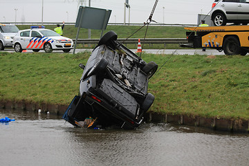 Image showing Car in water after an accident