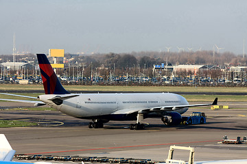 Image showing plane pulled back to the runway