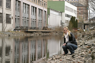 Image showing Woman by City River
