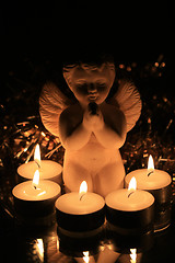 Image showing Christmas angel and votive lights