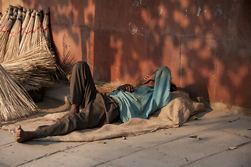 Image showing Taking a nap on the street in the late evening sun.