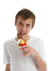 Image showing Boy eating chocolate bunny