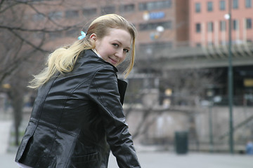 Image showing Woman Sitting in City