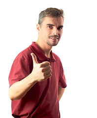 Image showing young man thumb up and smiling isolated on white