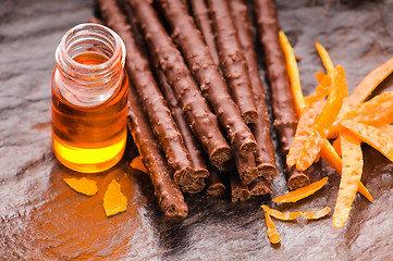 Image showing chocolate sticks with orange