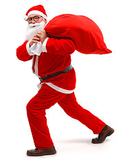 Image showing Santa claus walking with full bag