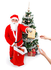 Image showing Santa Claus giving a gift