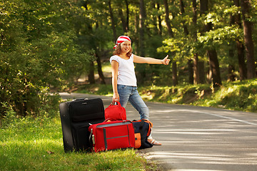 Image showing Young hitch-hiker girl