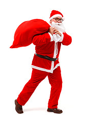 Image showing Santa claus walking with full bag