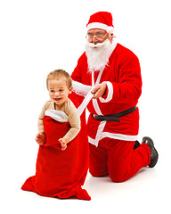 Image showing Boy in Santa Claus's bag