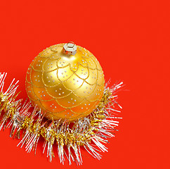 Image showing Golden ornament and garland on red