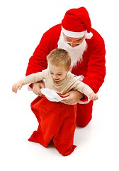 Image showing Boy in Santa Claus's bag