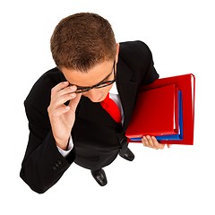 Image showing Young man with folders