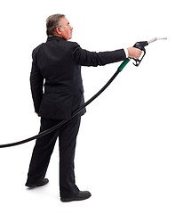 Image showing Business man pointing with gas nozzle