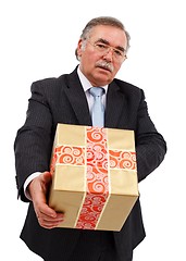 Image showing Senior man offering gift