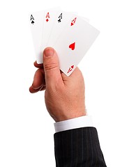 Image showing Man's hand holding aces