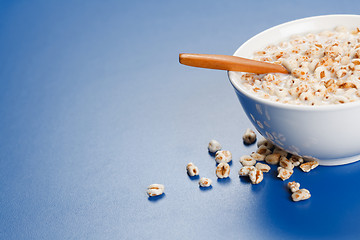 Image showing Popped wheat flakes in milk