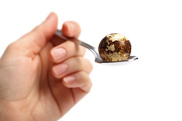 Image showing Quail egg in spoon