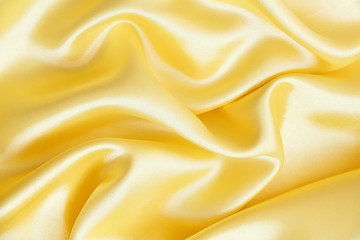 Image showing Smooth elegant golden silk as background 