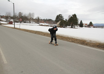 Image showing Skateboard in high speed.