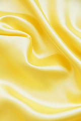 Image showing Smooth elegant golden silk can use as background 