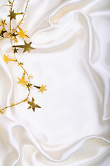 Image showing Golden stars on white silk
