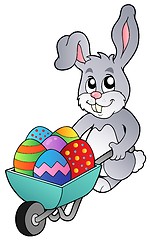 Image showing Bunny holding wheelbarrow with eggs