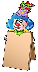 Image showing Clown holding information board