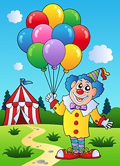 Image showing Clown with balloons near tent