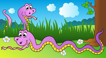 Image showing Two cartoon snakes on meadow