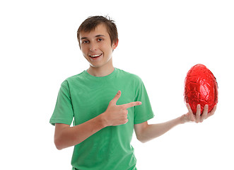 Image showing Boy pointing to an easter egg