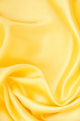 Image showing Smooth elegant golden silk as background 