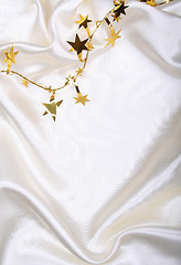 Image showing Golden stars on white silk