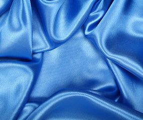 Image showing Smooth elegant blue silk as background 