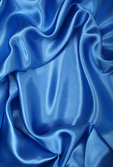 Image showing Smooth elegant blue silk as background 