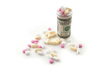 Image showing Pills in a bottle made of money