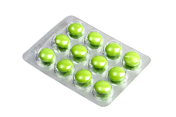 Image showing Package of green pills isolated on white 