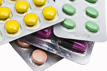 Image showing Colorful pills closeup on white background 