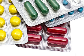 Image showing Colorful pills closeup on white background 