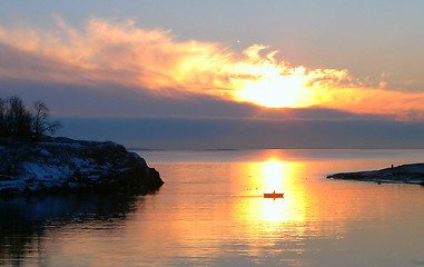 Image showing Winter Sunset with Boat in Finland