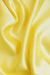 Image showing Smooth elegant golden silk as background 