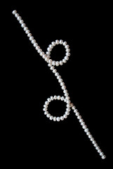 Image showing White pearls on the black velvet background 