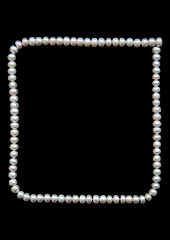 Image showing White pearls on the black velvet background 