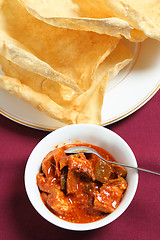 Image showing Mango pickle and pappadum vertical