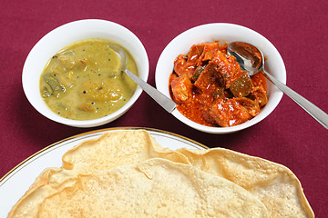 Image showing Poppadoms with lime and mango pickles