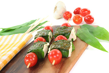 Image showing Feta cheese in wild garlic coat