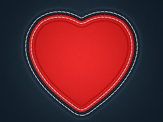 Image showing Red stitched heart shape on black leather