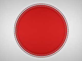 Image showing Red and grey stitched circle shape on leather