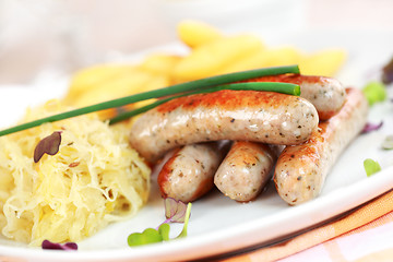 Image showing White sausage with sour cabbage